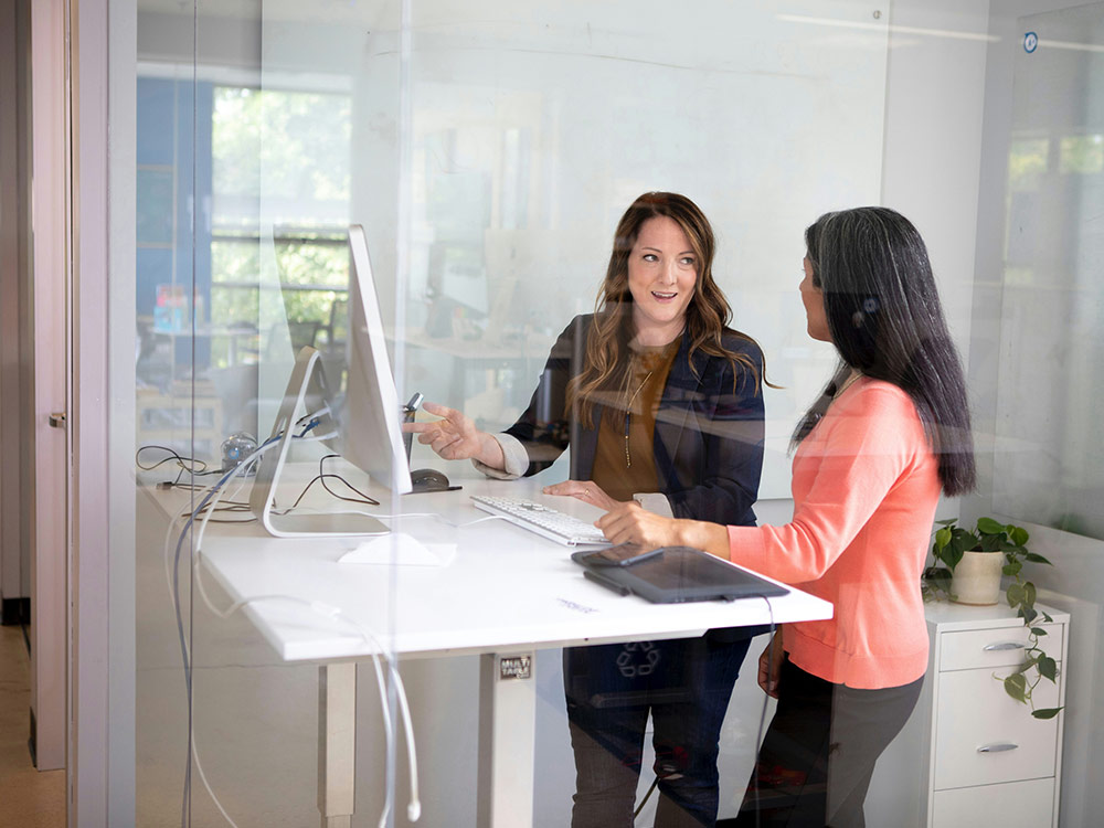  motivated working mother at a classroom desk, symbolizing dedication and engagement in her learning journey